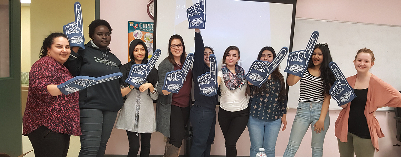 women holding foam fingers