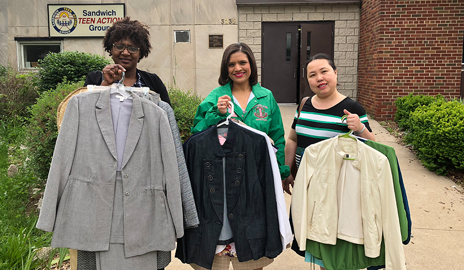 women holding clothes