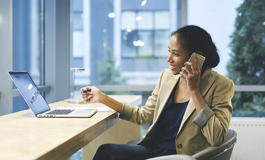 woman at her desk in new clothes